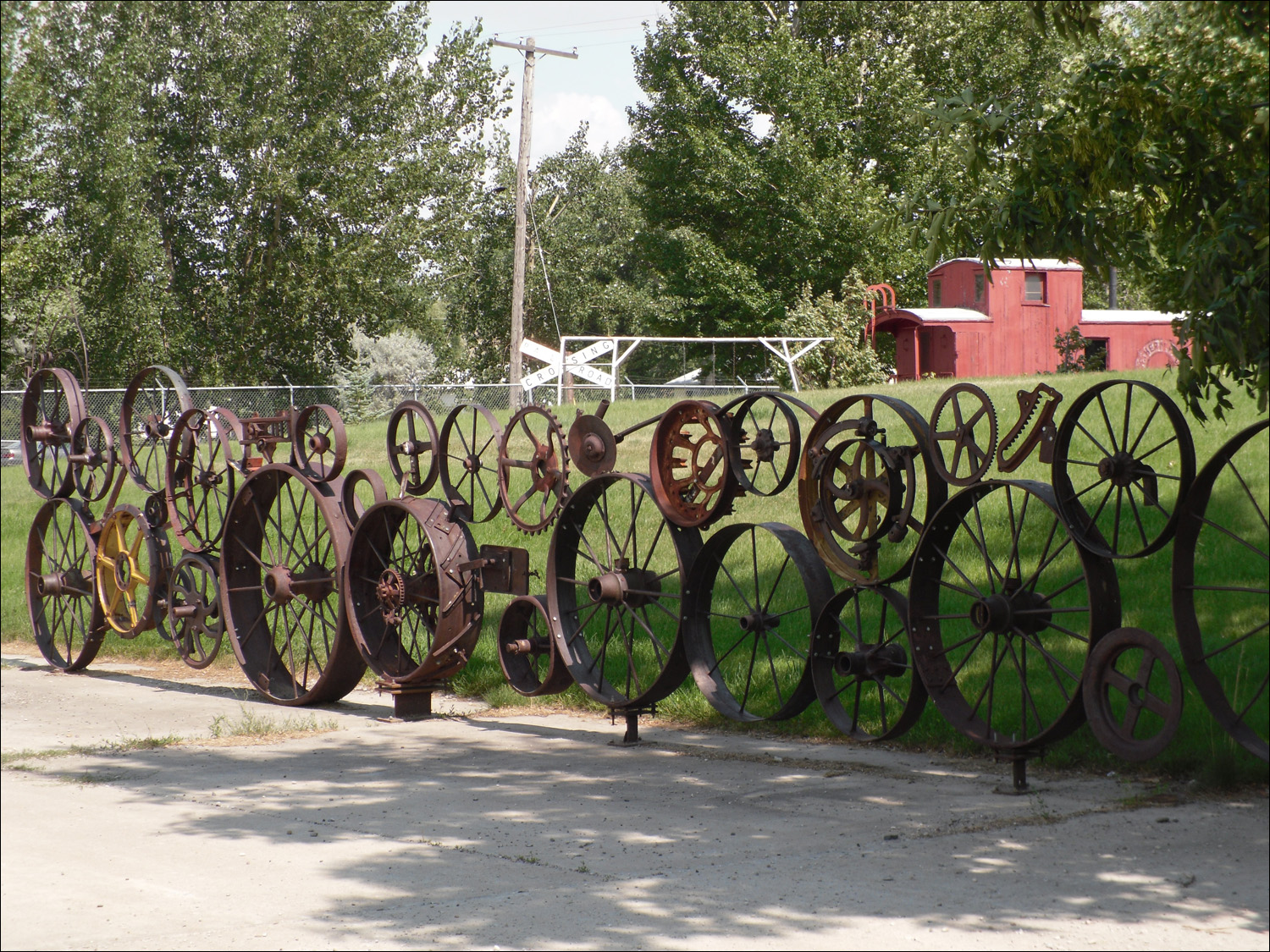 Fort Benton, MT Agriculture Museum-fence of old iron wheels